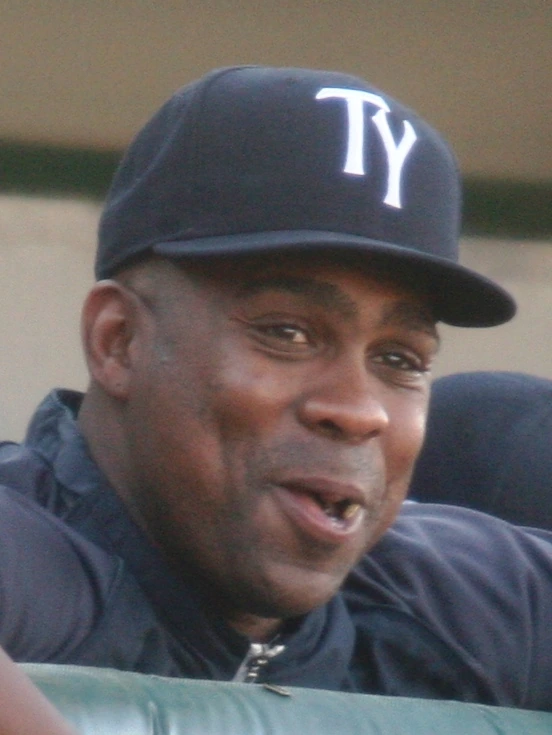 Marcus Thames in a baseball uniform and cap