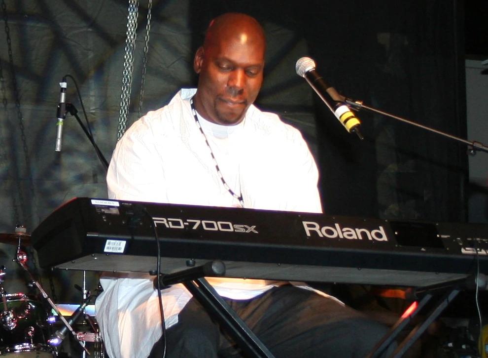 Marcus Tankard performing at a keyboard on stage